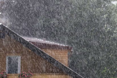 downpour-in-summer-with-house-and-tree-picture-id830590498-47284443.jpg